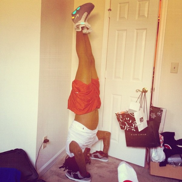 celebrity-sneaker-watch-wale-does-handstand-in-supreme-dunk-low-and-nike-air-mag-2