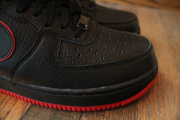 all black air force ones with red bottom