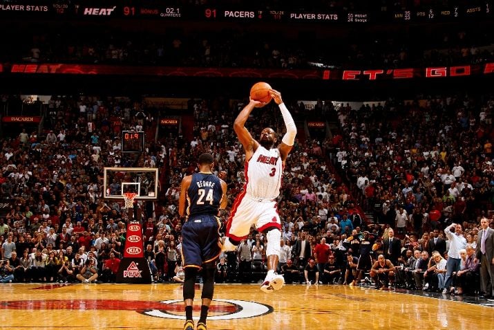 Dwyane Wade Dons ‘White/Varsity Red-Black’ Air Jordan XIV in OT Win