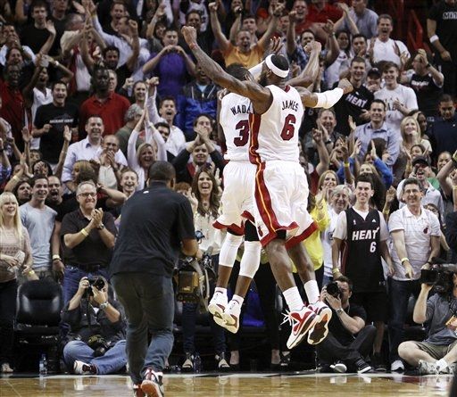 Dwyane Wade Dons 'White/Varsity Red-Black' Air Jordan XIV in OT Win