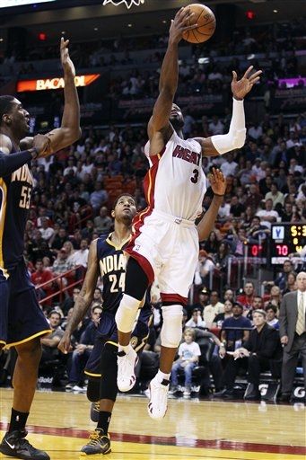 Dwyane Wade Dons 'White/Varsity Red-Black' Air Jordan XIV in OT Win