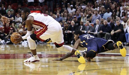 Dwyane Wade Dons 'White/Varsity Red-Black' Air Jordan XIV in OT Win