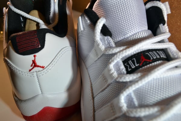 Air Jordan 11 Low White/Varsity Red-Black at Millennium Shoes