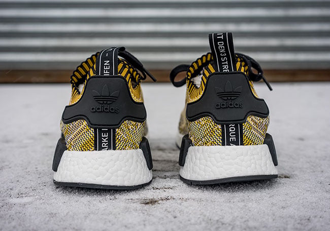 yellow and black nmds