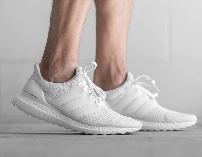 white ultra boost on feet