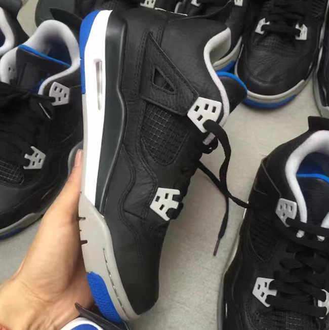 black and blue jordan 4s