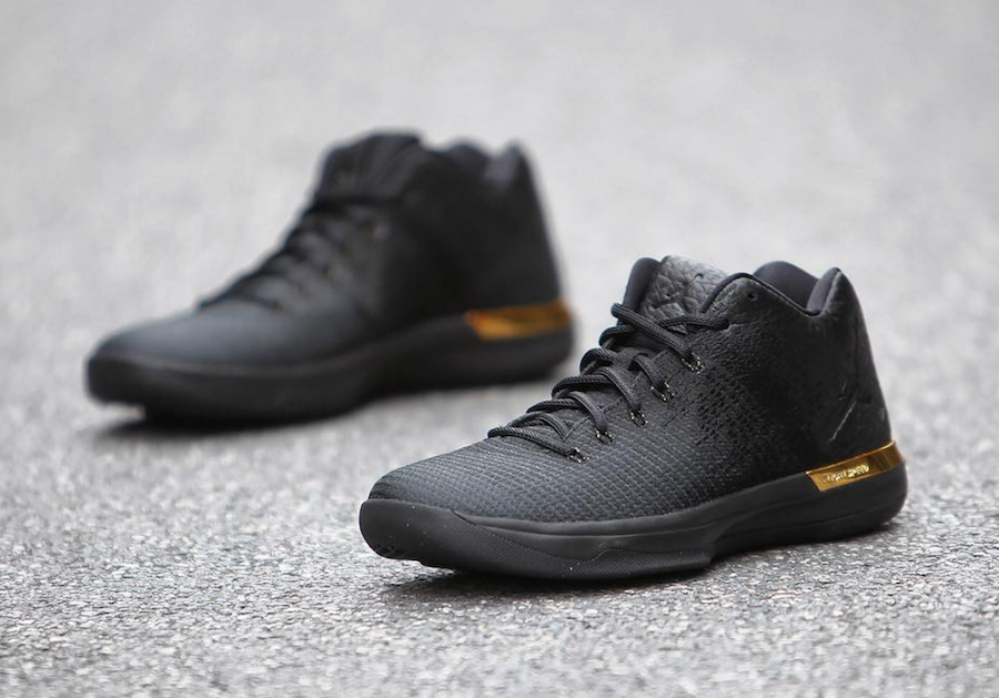 black and gold jordans low top