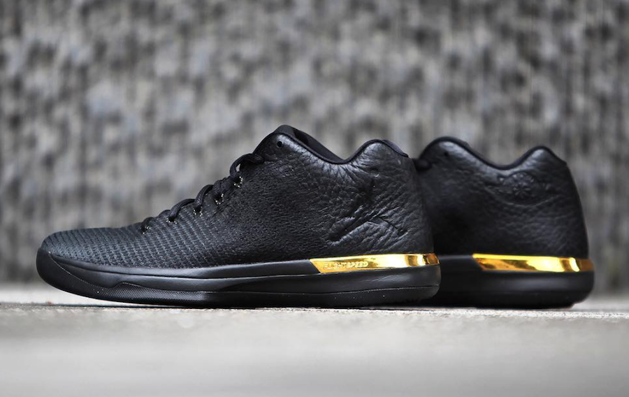 all black jordans with gold logo