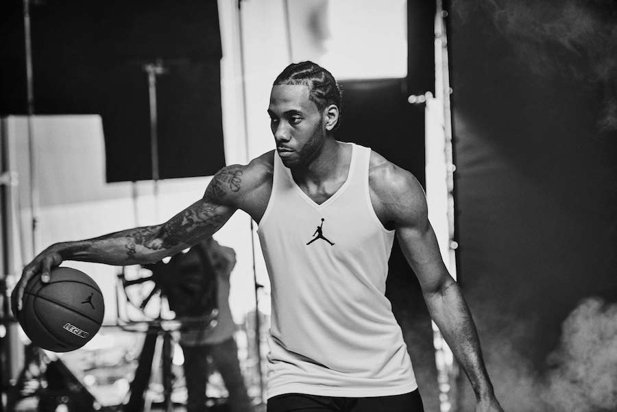 Kawhi Leonard in ‘Gold’ Air Jordan 5s at Kendrick Lamar’s DAMN Tour