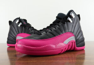 pink and black jordan's 12