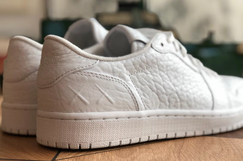 KAWS Air Jordan 1 Low Swooshless PE