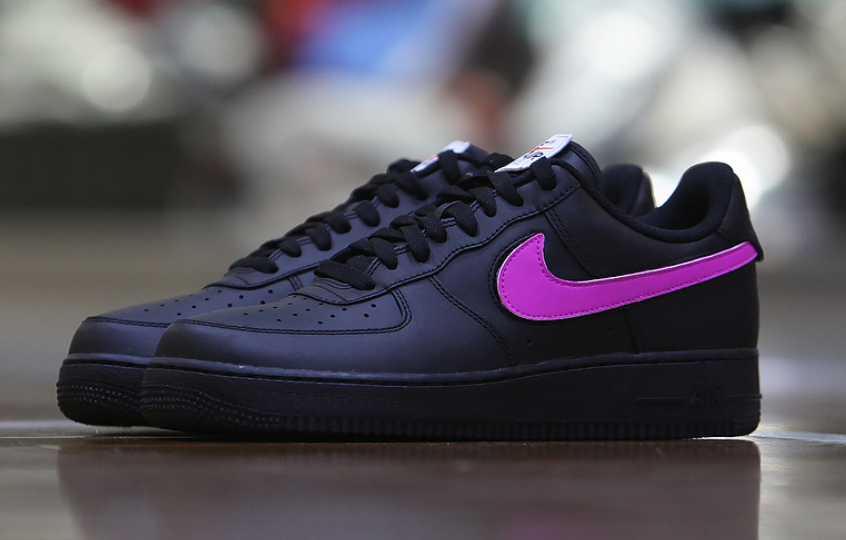 black nike with purple swoosh