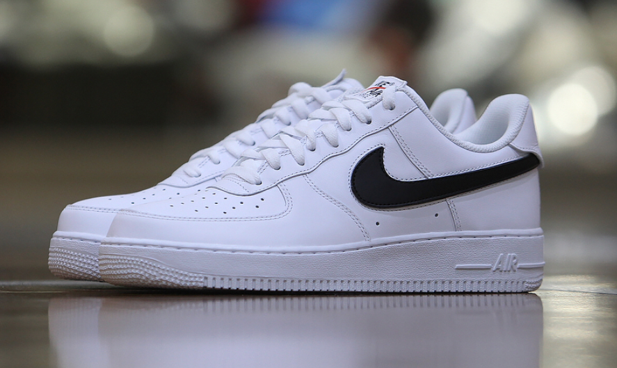 white nike air force 1 with black swoosh