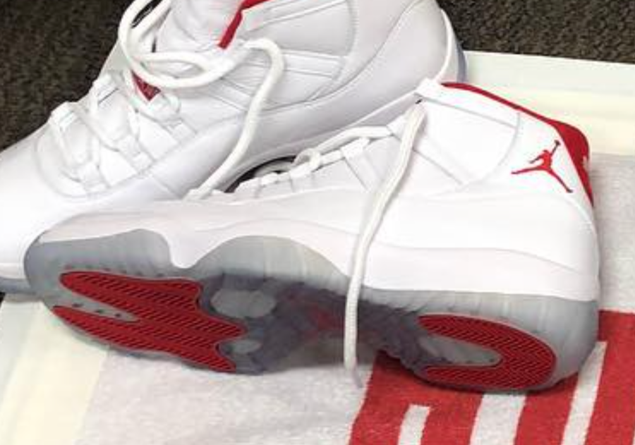red and white jordan 11's