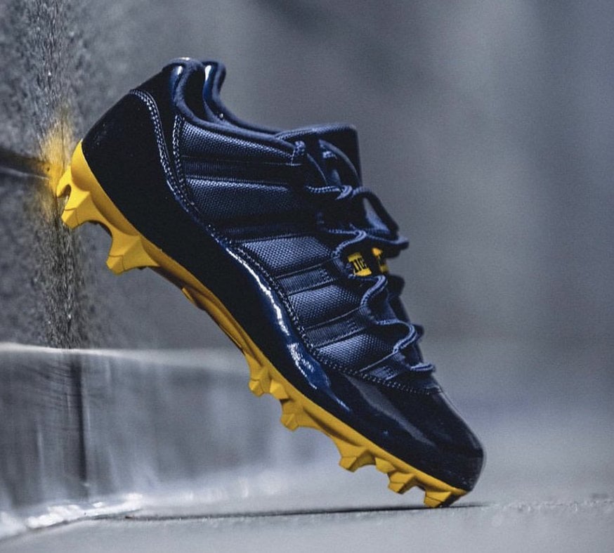 black and gold jordan cleats