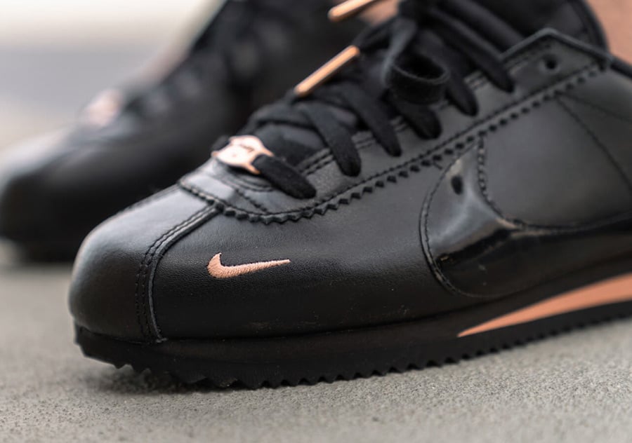 black nikes with rose gold swoosh