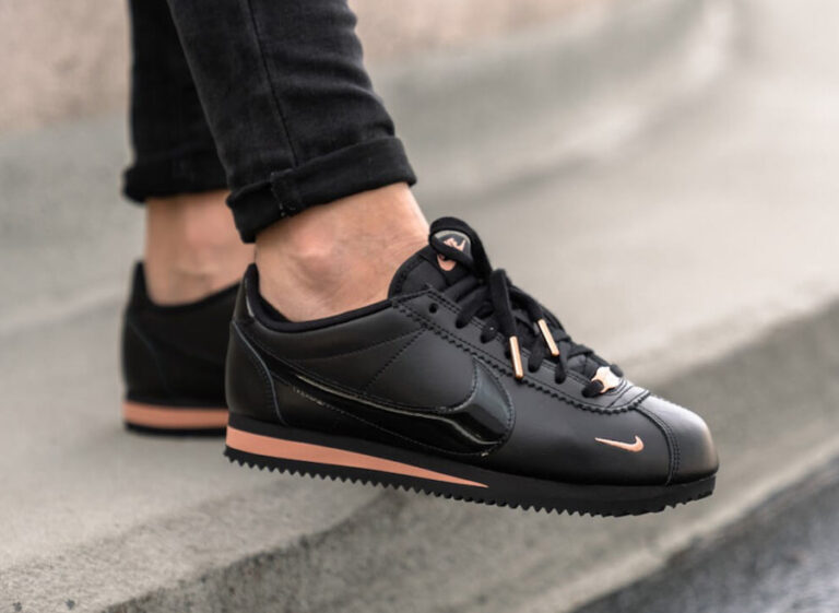 pink nike cortez with gold swoosh