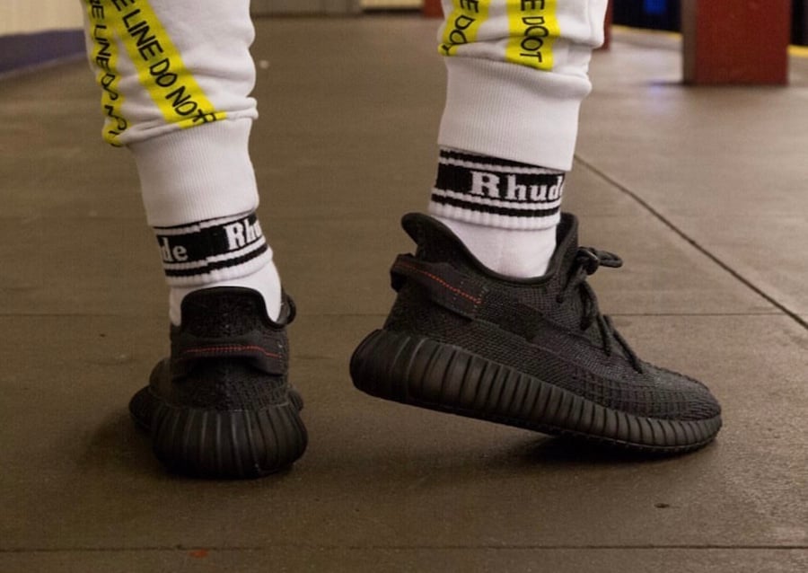 yeezy black reflective on feet