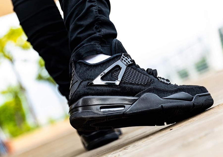 jordan retro 4 black cat on feet