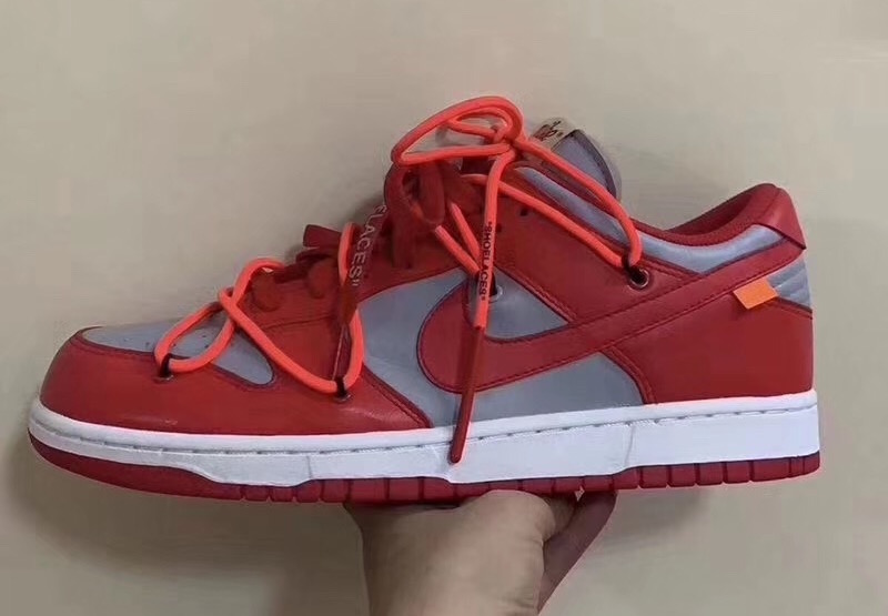 dunk low university red on feet