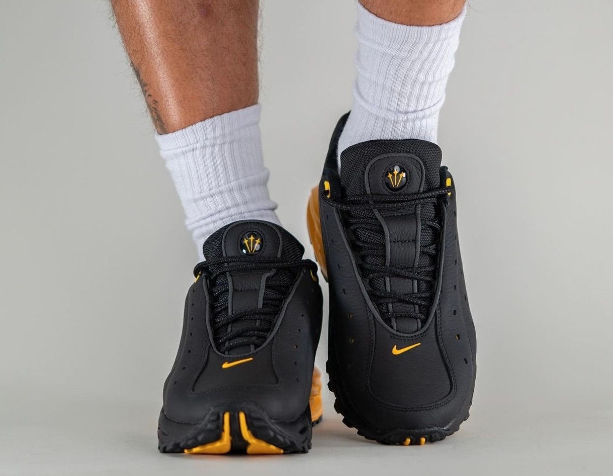 NOCTA Nike Hot Step Air Terra Black University Gold DH4692-002 On-Feet