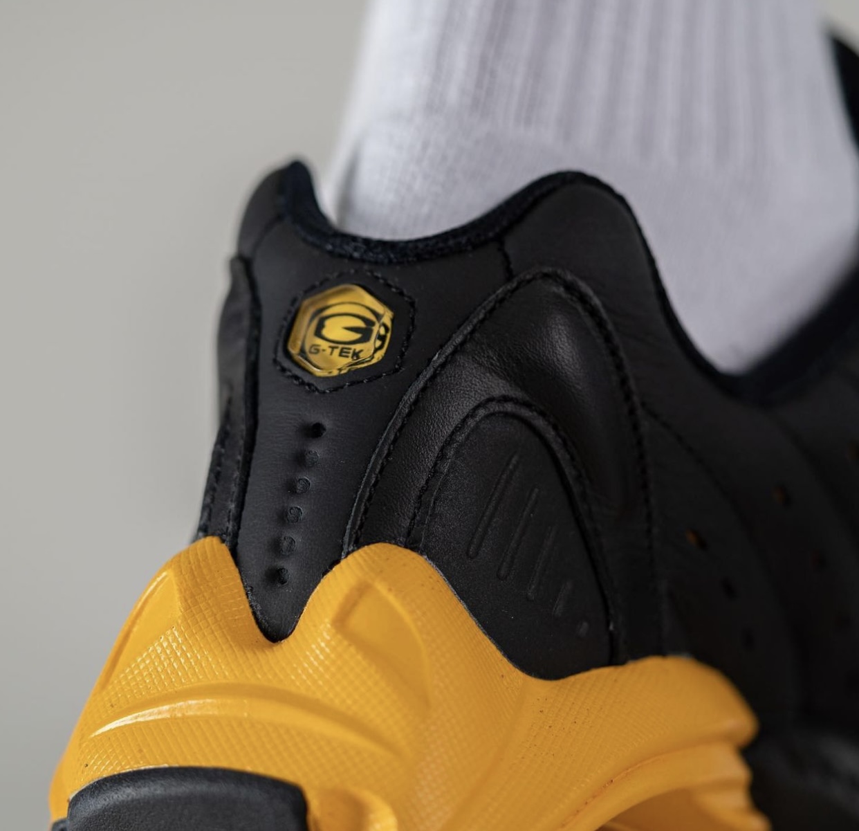 NOCTA Nike Hot Step Air Terra Black University Gold DH4692-002 On-Feet